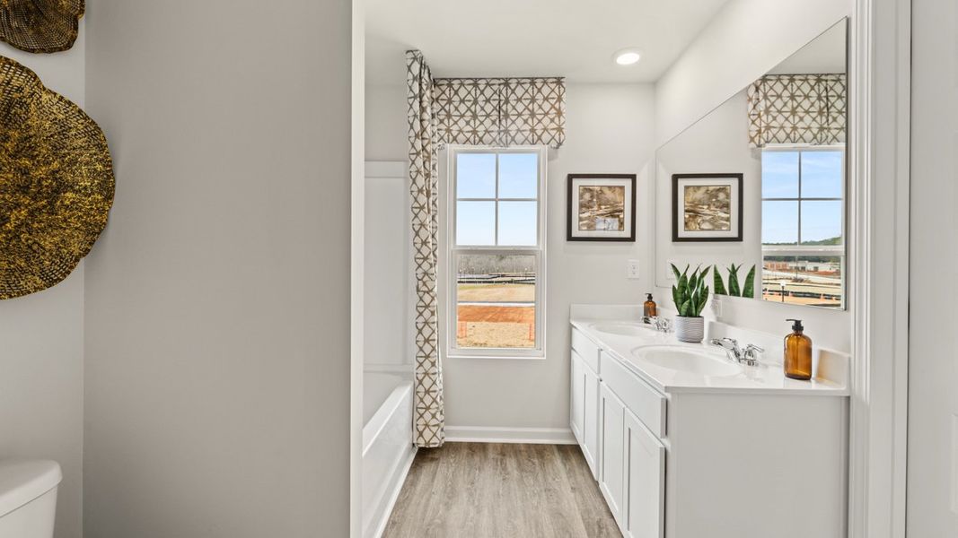 Furnished interior in a model home at The Reserve at North Bridges in McDonough (Image 19).