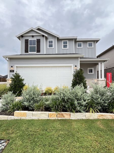 A charming gray home with manicured landscaping in Ashford Crossing by Centex (Princeton, TX). A charming gray home with manicured landscaping in Ashford Crossing by Centex (Princeton, TX).