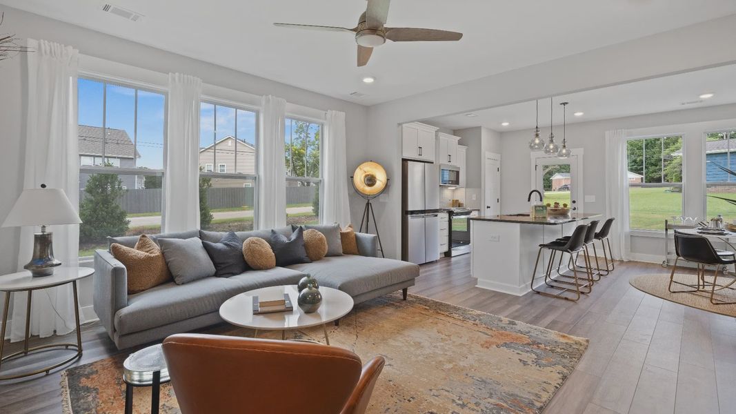 Spacious hardwood flooring family room with ceiling fan at Barton Hollow by DRB Homes in Fountain Inn, SC