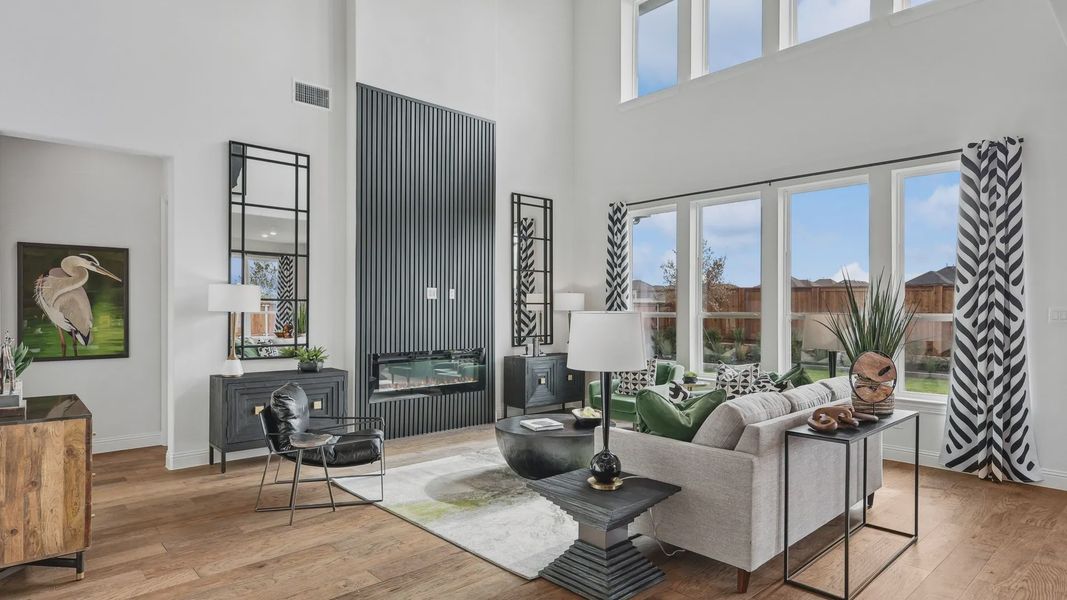 High ceilings and expansive windows enhance the refined living space in Green Meadows, exuding modern luxury. High ceilings and expansive windows enhance the refined living space in Green Meadows, exuding modern luxury.