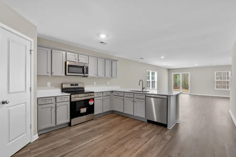 Furnished interior in a model home at Harmon Terrace in Hopkins (Image 3).