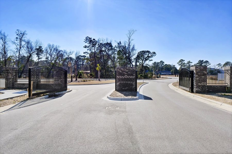 Entrance to the Indigo at Abbey Preserve community in Wilmington, NC, featuring signage and landscaping (Image 11).