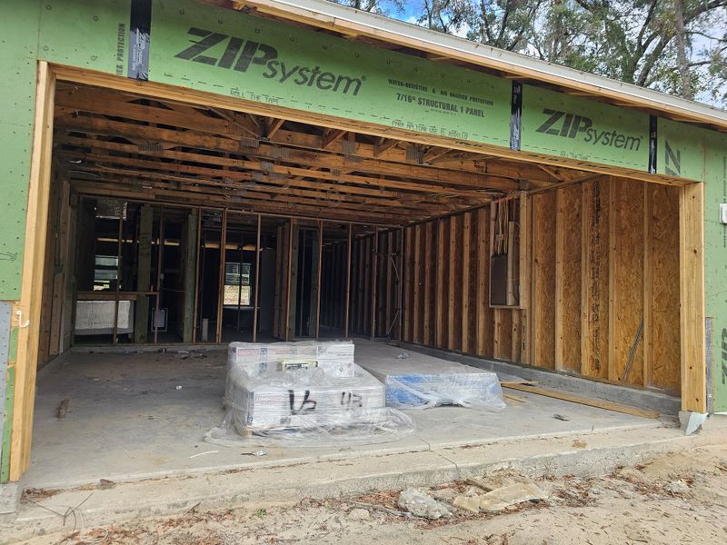 An under-construction home with visible wood framing in Inverness by Maronda Homes (Inverness, FL).