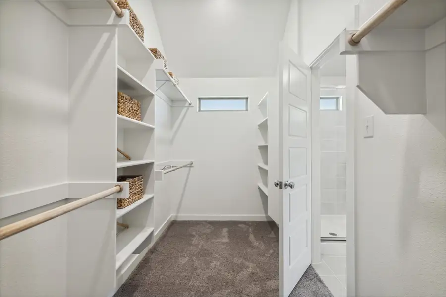REPRESENTATIVE PHOTO – Primary Closet in a Diamond model home by Trophy Signature Homes