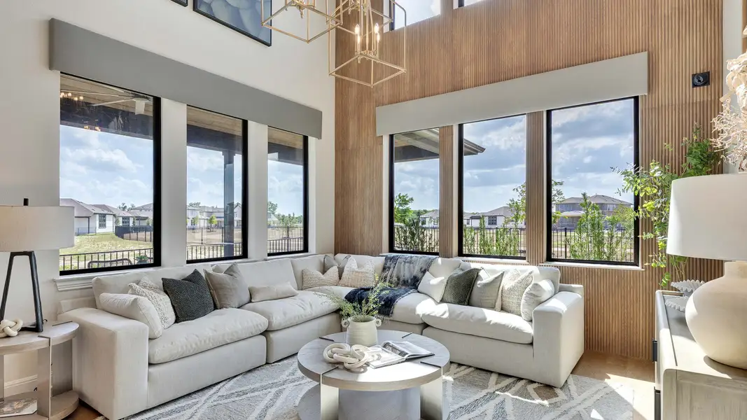 Revel in the grandeur of this Lakeside Meadows living room, boasting soaring windows and chic wooden accents. Revel in the grandeur of this Lakeside Meadows living room, boasting soaring windows and chic wooden accents.