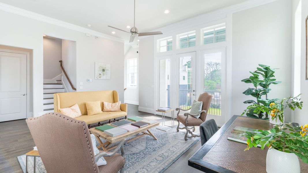 Furnished interior in a model home at Upper East River in Houston (Image 9).