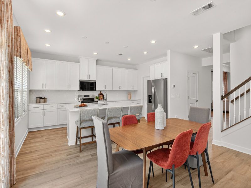 The dining area is perfectly located between the great room and kitchen.