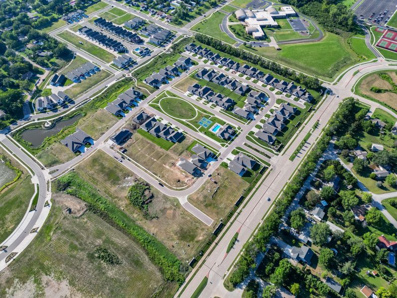 Aerial view of the The Courtyards at The Heritage community in Andover, KS, showing layout and nearby surroundings (Image 15). Aerial view of the The Courtyards at The Heritage community in Andover, KS, showing layout and nearby surroundings (Image 15).