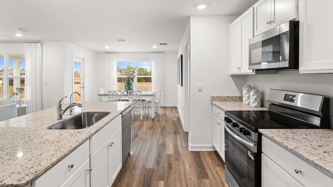 Furnished interior in a model home at Magnolia at the Bluffs Phase 3 in Freeport (Image 6).