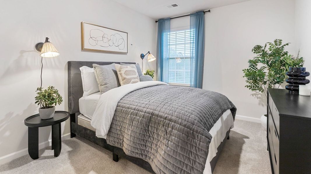 Furnished interior in a model home at The Townes at Ridgewood Farms in Winterville (Image 18).