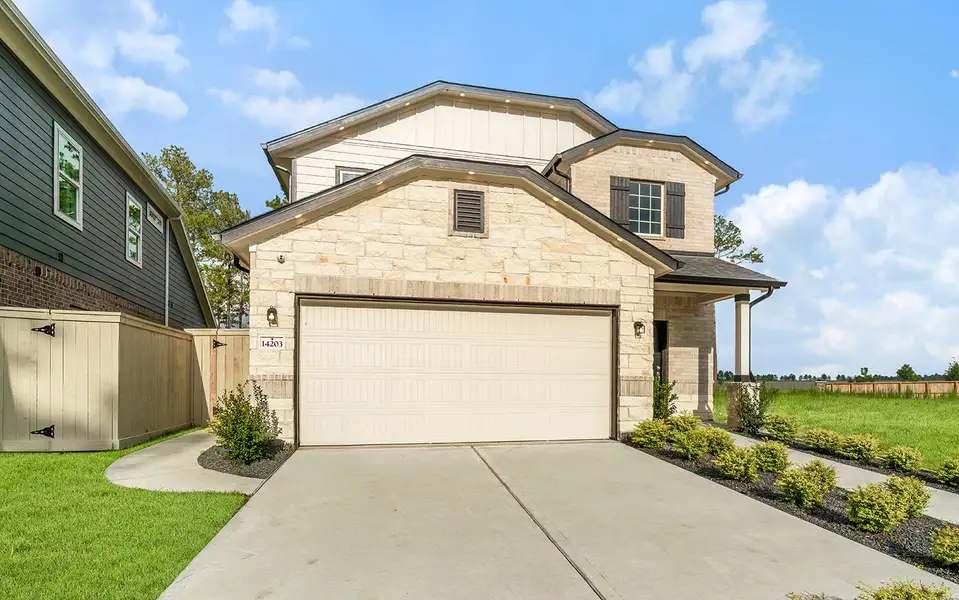 Front exterior of a home in the The Canopies community, located in Splendora, TX (Image 2). Front exterior of a home in the The Canopies community, located in Splendora, TX (Image 2).