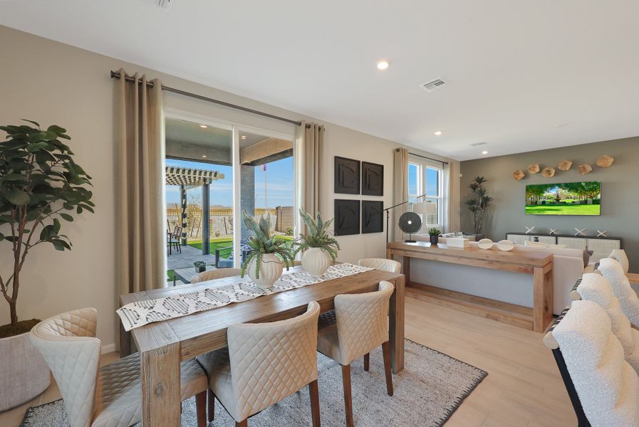 A dining room with a large window. A dining room with a large window.