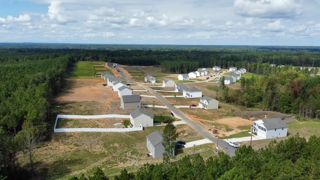 A group of buildings in a field.