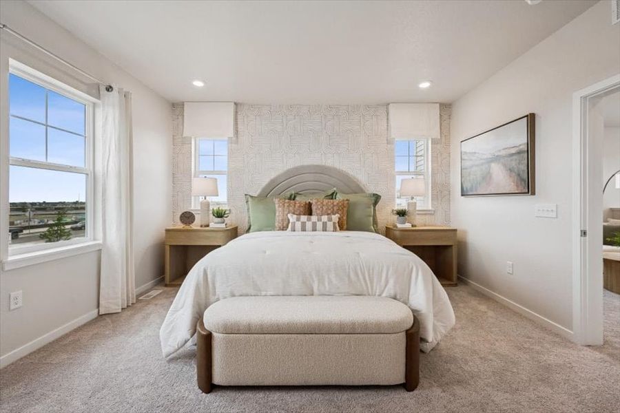 A bedroom with a bed and a couch. A bedroom with a bed and a couch.