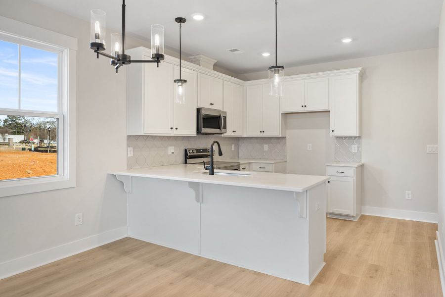 Furnished interior in a model home at Renaissance Place in Greenville (Image 14).