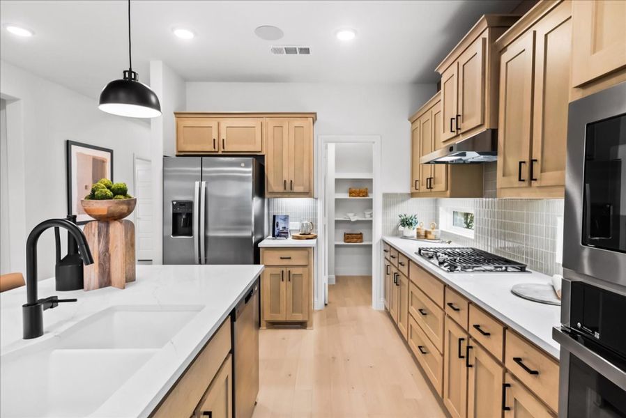 Furnished interior in a model home at The Reserve at Spiritas Ranch in Little Elm (Image 21).