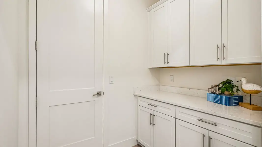 Furnished interior in a model home at Ardisia Park in New Smyrna Beach (Image 58).