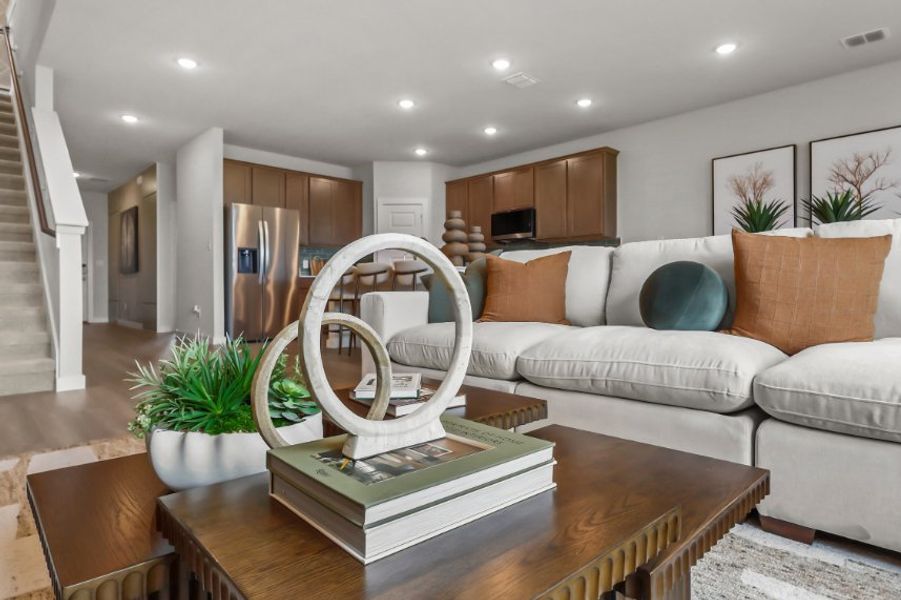 A living room with a couch and a table. A living room with a couch and a table.