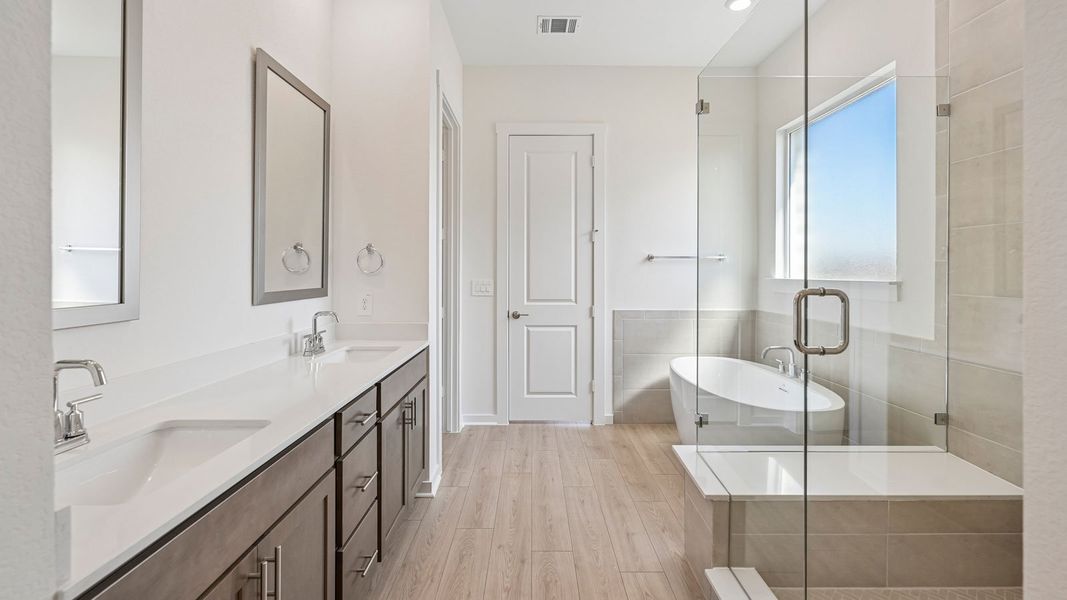 Furnished interior in a model home at The Enclave at Bar W Ranch in Leander (Image 11).