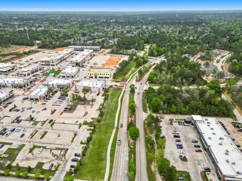 Aerial view of the Woodforest Townhomes: Townhomes: The Patios community in Montgomery, TX, showing layout and nearby surroundings (Image 11). Aerial view of the Woodforest Townhomes: Townhomes: The Patios community in Montgomery, TX, showing layout and nearby surroundings (Image 11).