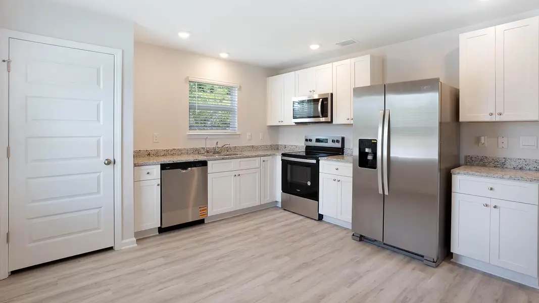 Furnished interior in a model home at Sunny Hills in Chipley (Image 8).