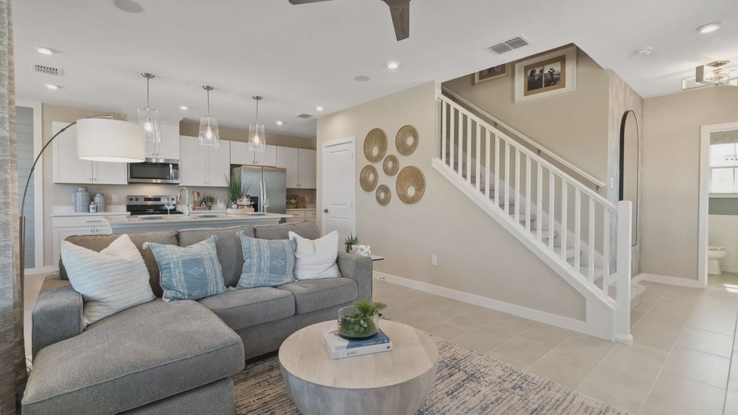 Beautiful living space by DRB Homes, featuring an open staircase and spacious layout for comfort and style Beautiful living space by DRB Homes, featuring an open staircase and spacious layout for comfort and style