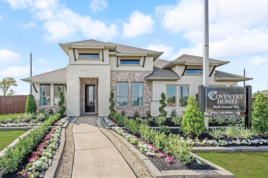 Front exterior of a home in the Meridiana 60' community, located in Manvel, TX (Image 13).
