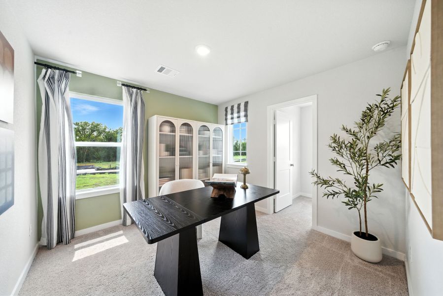 A room with a table and chairs. A room with a table and chairs.