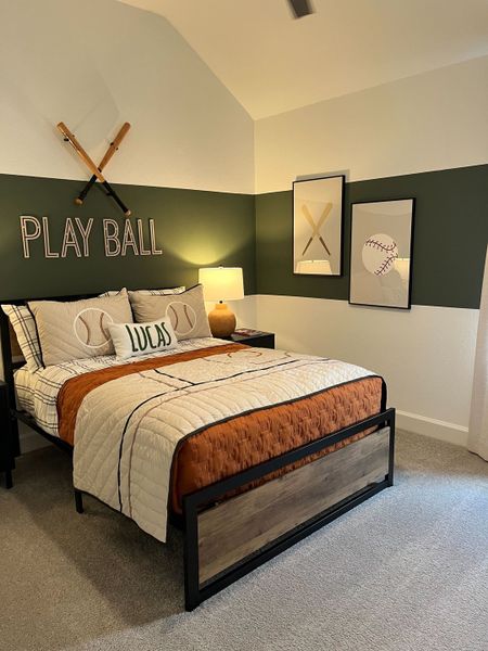 A sporty bedroom with baseball decor, crisp bedding, and playful wall art, creating a cozy and fun atmosphere.