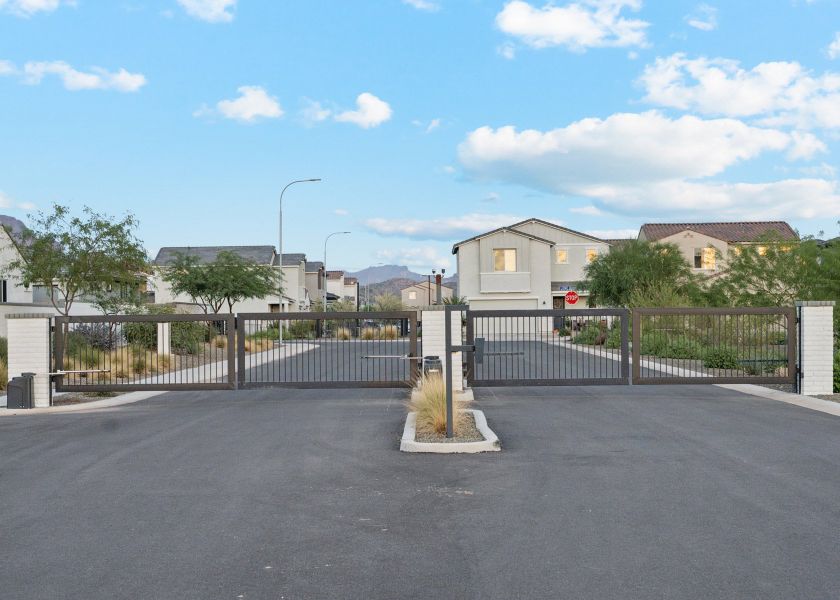 A road with a fence and trees on the side. A road with a fence and trees on the side.