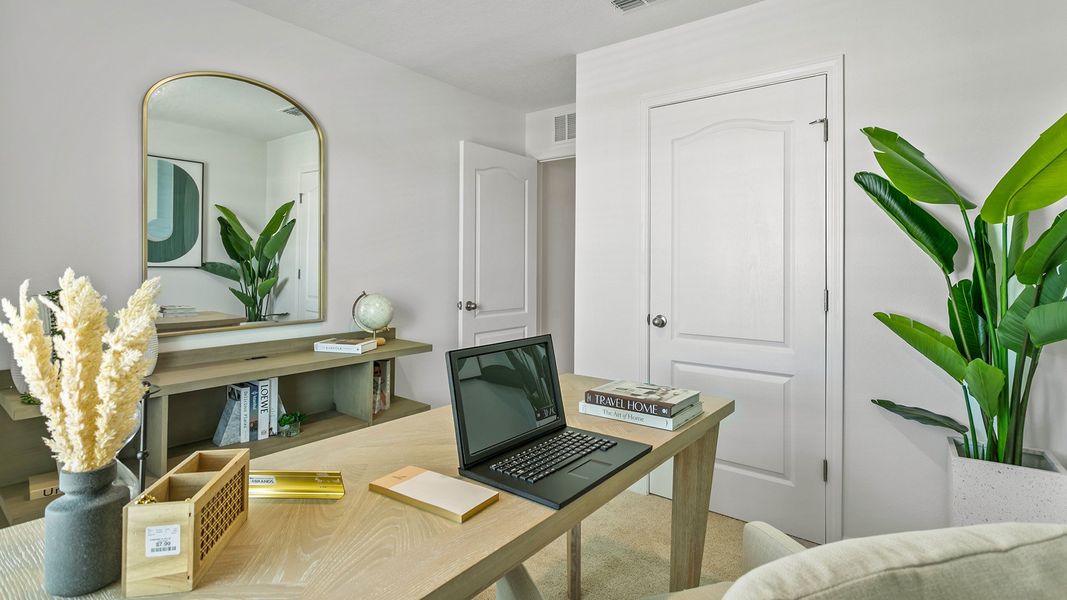 Furnished interior in a model home at Stokes Landing in St. Augustine (Image 23).
