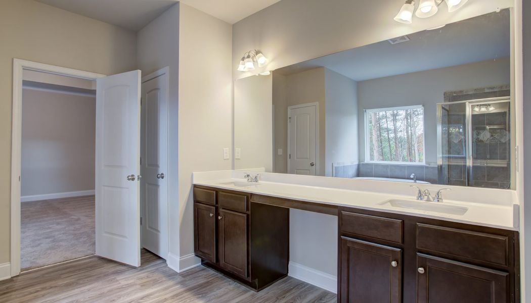 Furnished interior in a model home at North Village in Rydal (Image 21).