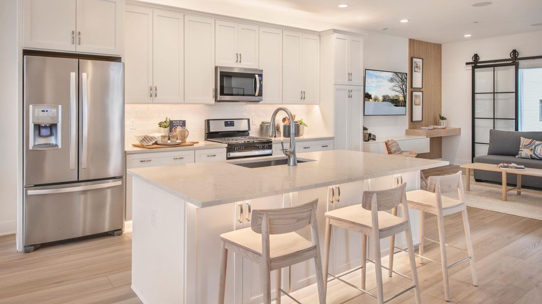 Spacious kitchen boasts stainless steel appliances and large center island Spacious kitchen boasts stainless steel appliances and large center island