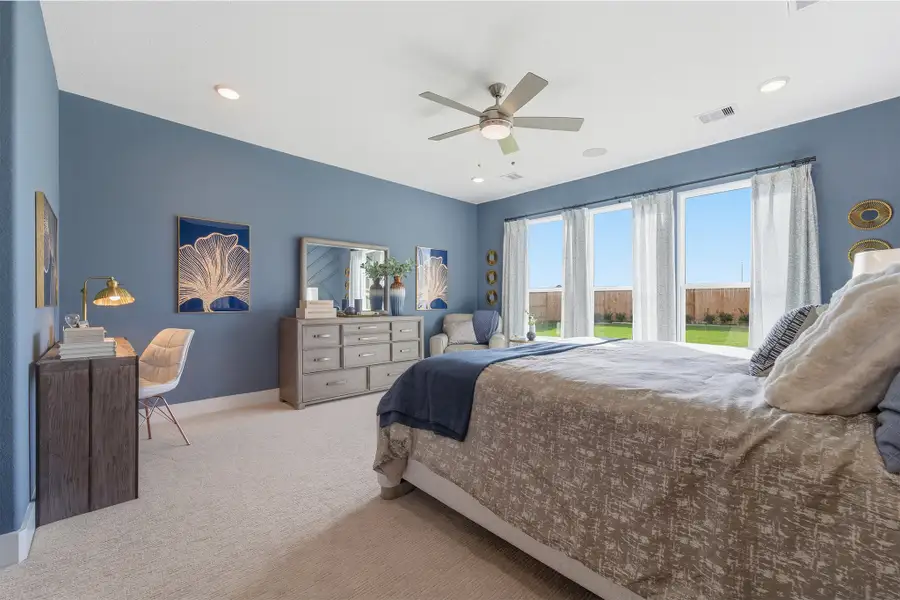 Furnished interior in a model home at Wildrye in Waller (Image 47).