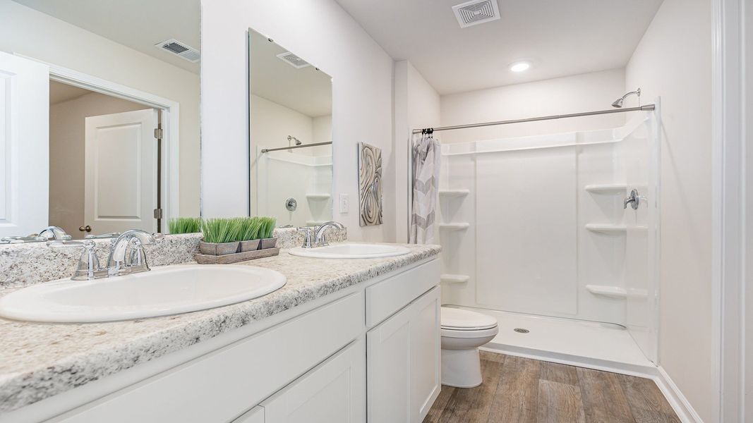 Furnished interior in a model home at Silver Oaks in Ocean Isle Beach (Image 15).