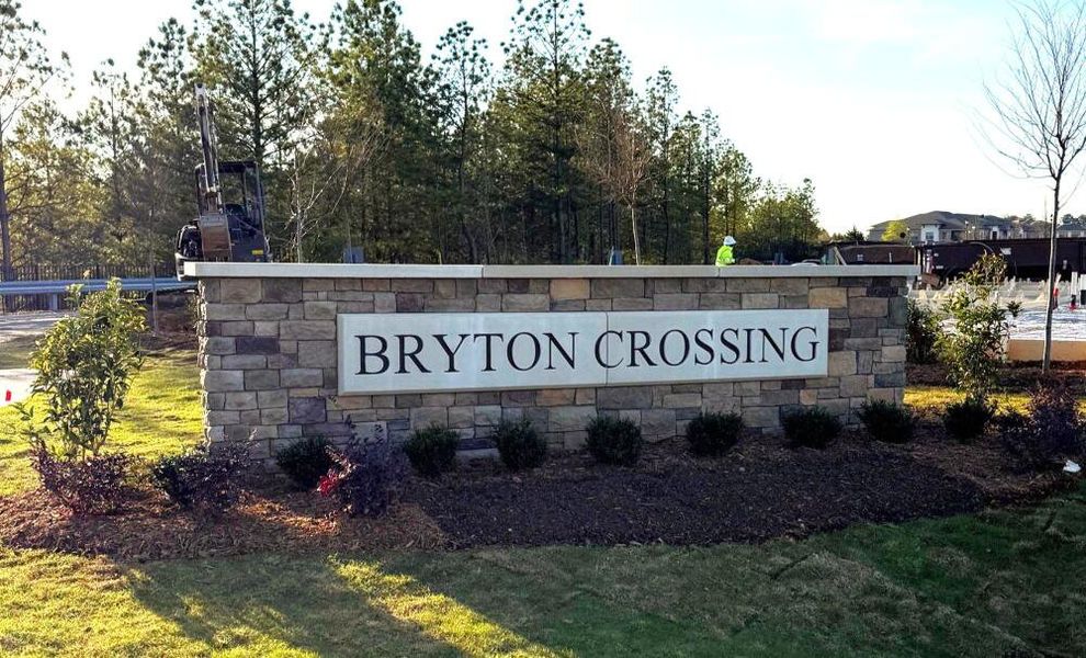 Entrance to the Bryton Crossing Townhomes community in Huntersville, NC, featuring signage and landscaping (Image 2).