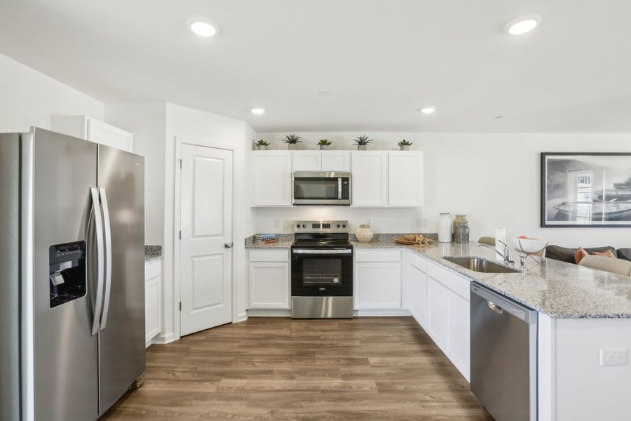 A kitchen with white cabinets. A kitchen with white cabinets.