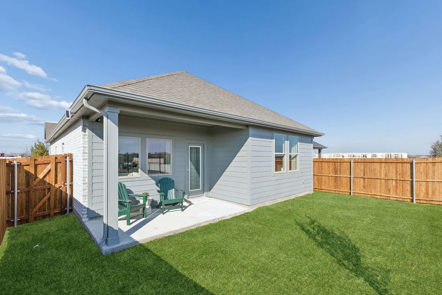 Covered Patio in a Nicholson Ranch Cedar Model Home in Lavon TX by Trophy Signature Homes