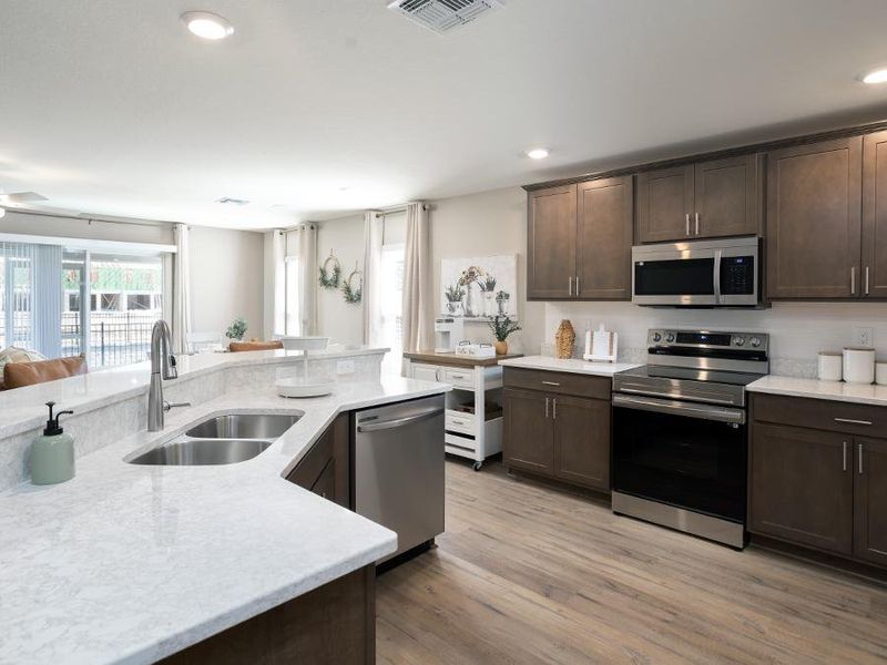 Your new kitchen is designed with luxurious finishes - Magnolia townhome in Plant City, FL