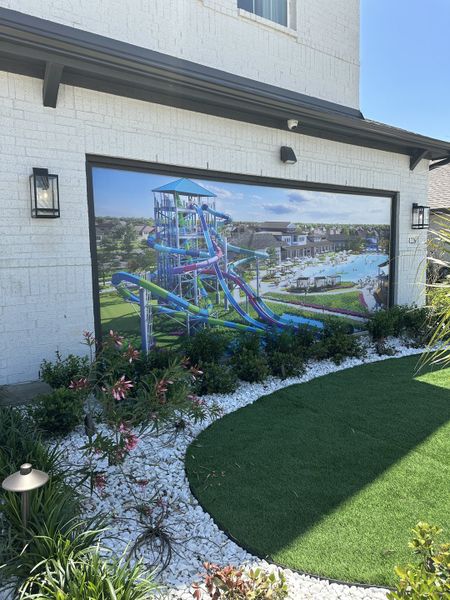 A modern white brick home with lush landscaping in Saint Tropez by Megatel Homes (Huffman, TX). A modern white brick home with lush landscaping in Saint Tropez by Megatel Homes (Huffman, TX).