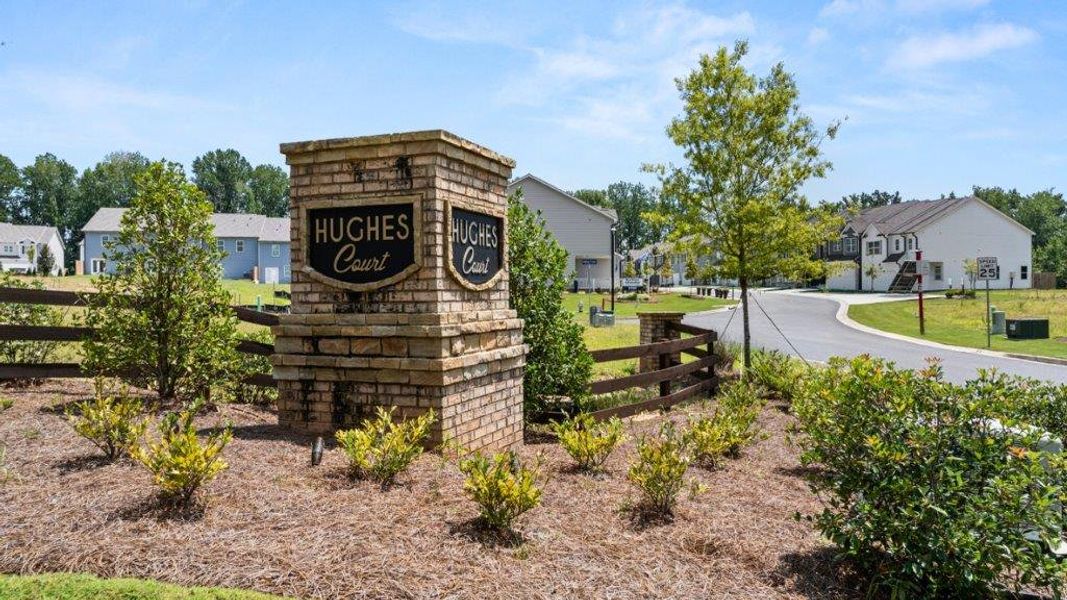 Entrance to the Hughes Court community in Dawsonville, GA, featuring signage and landscaping (Image 2). Entrance to the Hughes Court community in Dawsonville, GA, featuring signage and landscaping (Image 2).