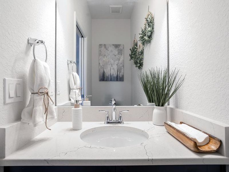 Along with a powder room for guests - Shelby model home in St. Cloud, FL