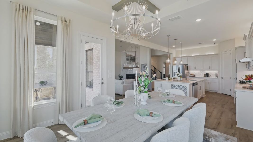Experience refined living with a chic chandelier and gourmet kitchen, showcasing high-end finishes in Kelly Ranch. Experience refined living with a chic chandelier and gourmet kitchen, showcasing high-end finishes in Kelly Ranch.