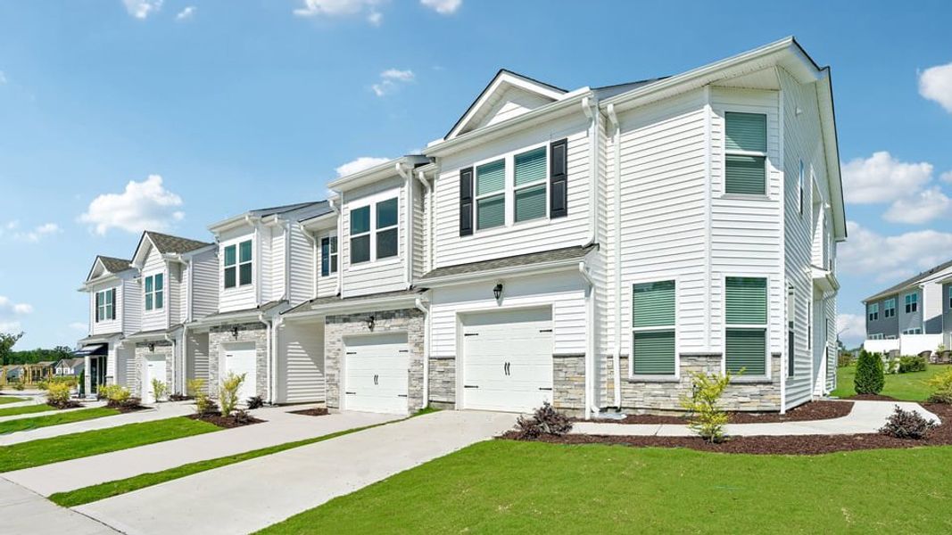 Front exterior of a home in the Chapel Townes community, located in Raleigh, NC (Image 4). Front exterior of a home in the Chapel Townes community, located in Raleigh, NC (Image 4).