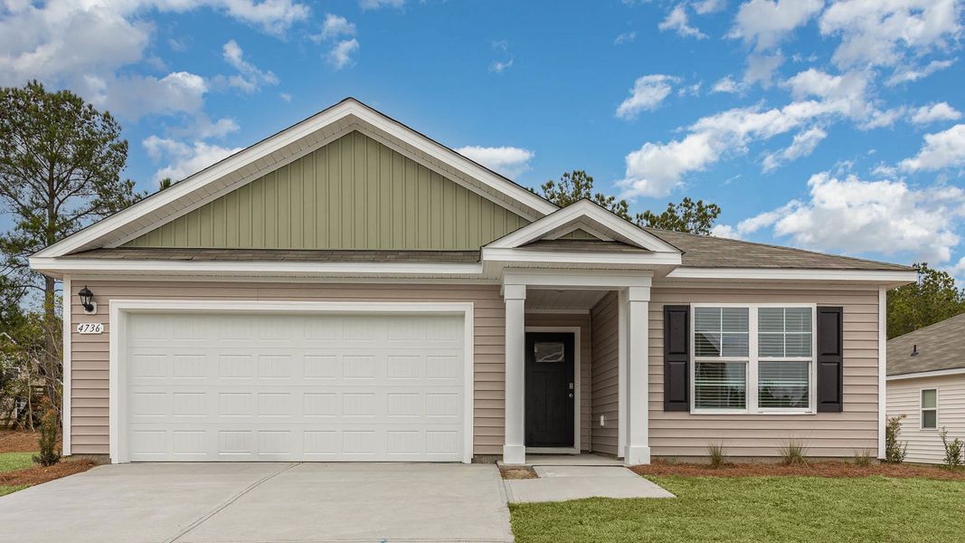 Front exterior of a home in the The Meadows at Wildwood Village community, located in Shallotte, NC (Image 4).