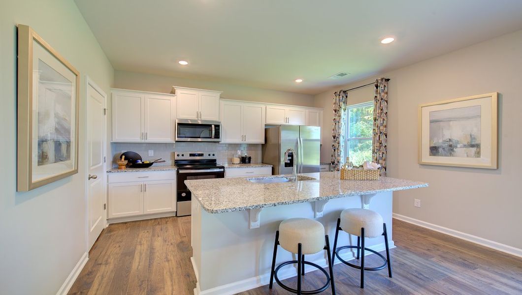 Furnished interior in a model home at Rydele Heights in Weaverville (Image 2).