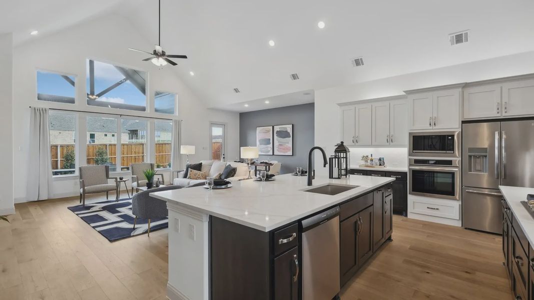 Expansive living space with vaulted ceilings, premium finishes, and abundant light in Westside Preserve.