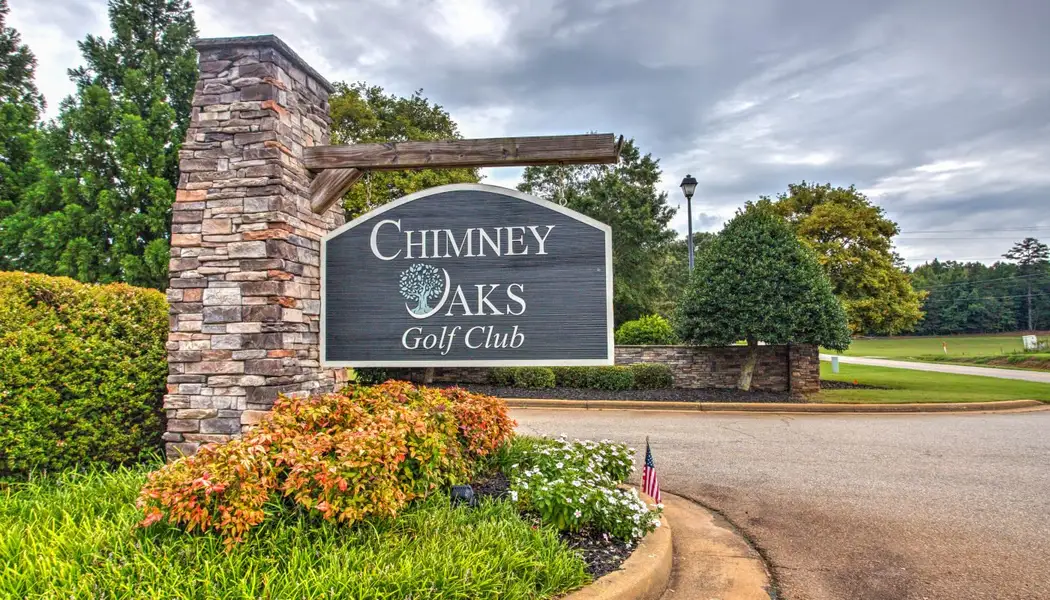 Entrance to the Chimney Oaks community in Homer, GA, featuring signage and landscaping (Image 2). Entrance to the Chimney Oaks community in Homer, GA, featuring signage and landscaping (Image 2).