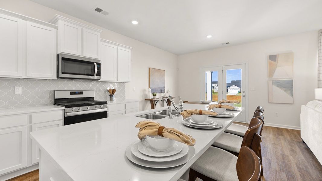 Furnished interior in a model home at Preserve at Dove Creek in Statham (Image 5).