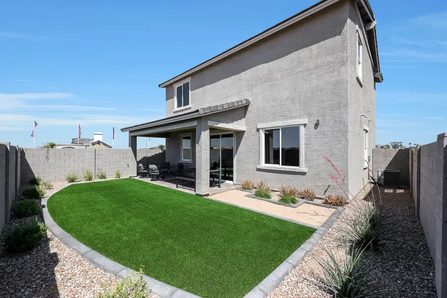 A house with a large front yard. A house with a large front yard.